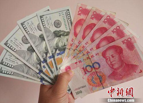 人民幣和美元資料圖。<a target='_blank' href='/' >中新網(wǎng)</a>記者 李金磊 攝