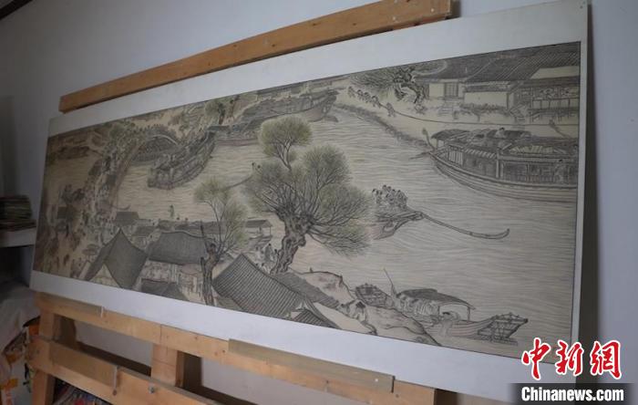 藺烈板刻線畫作品《清明上河圖》?！∪诸?攝